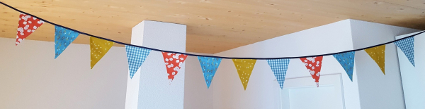 Wimpelkette Türkis-Safran-Koralle aus BIO Baumwolle